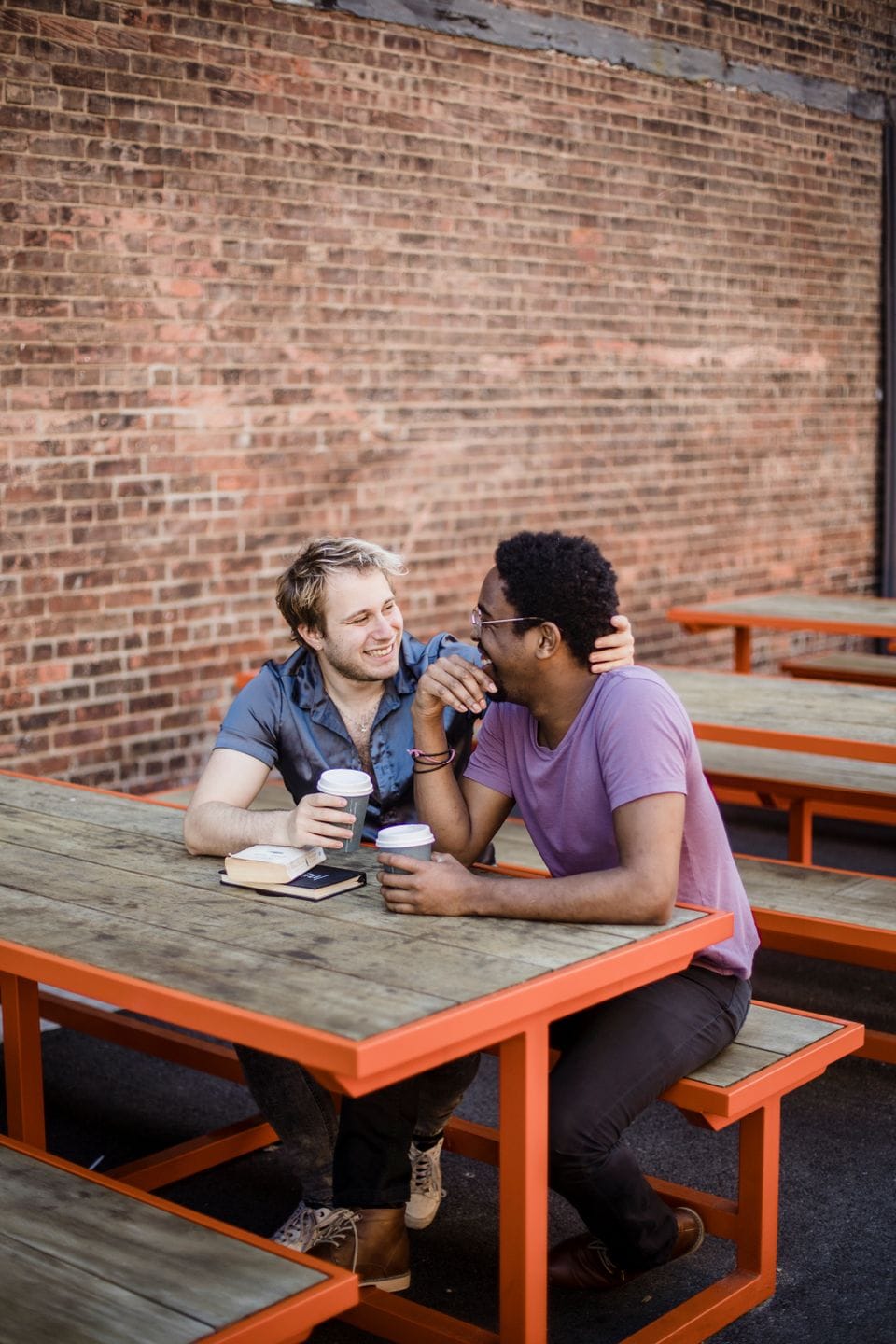 Two men talking at an outdoor café