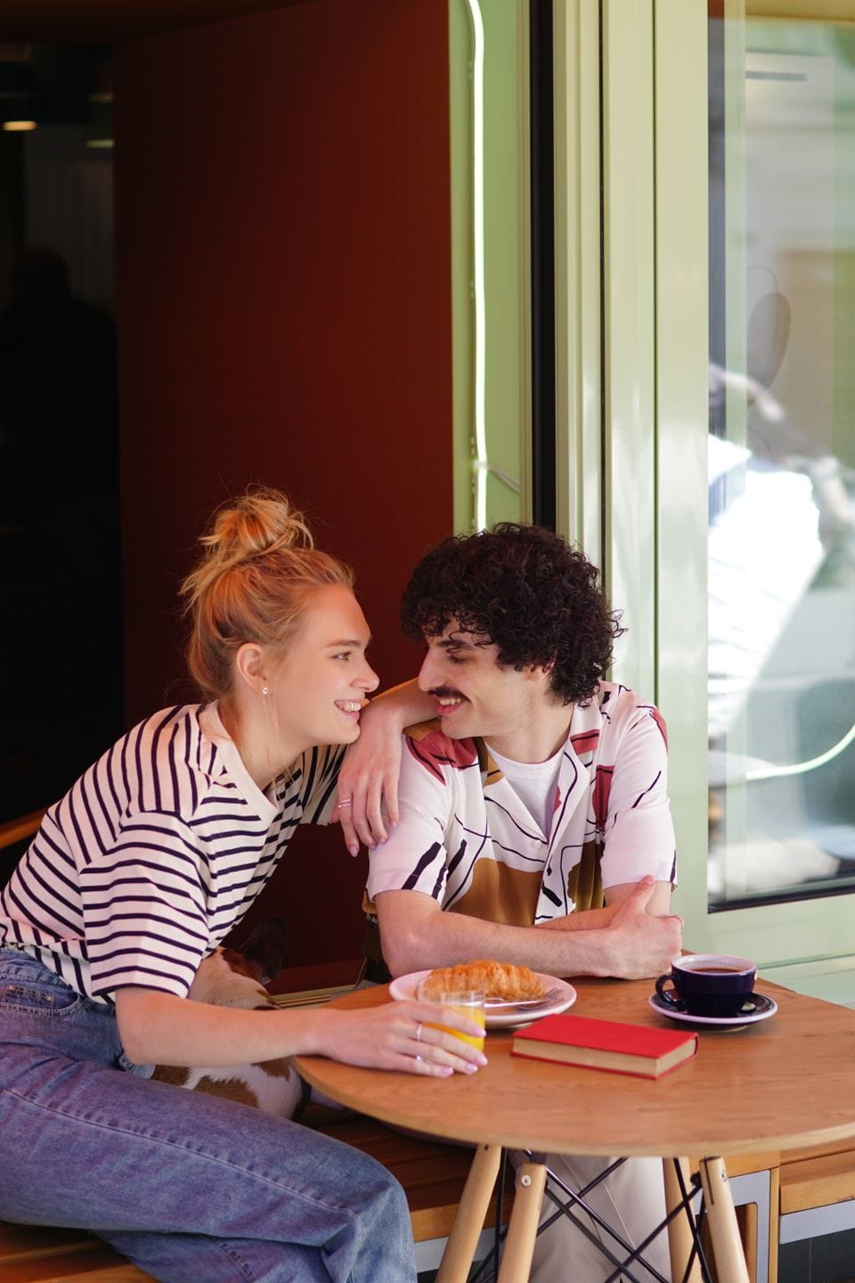 A couple enjoying coffee at a café